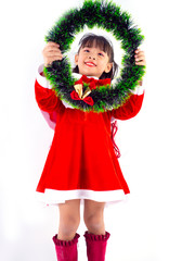 Asian girl is wearing a Santa costume to celebrate Christmas. White background
