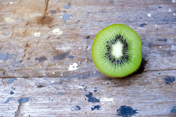 Ripe fresh kiwi fruits and half sliced