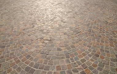 Old cobblestone pavement close-up.