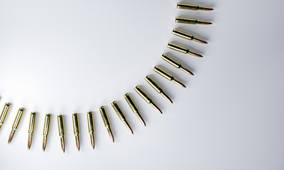 Bullet, shell on gray background. 3d illustration render. Shooting from automatic weapons. Gold bursts for advertisement. Military operations, shooting from gun. Cartridges lie in a circle