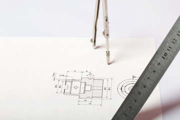 A figure drawn by a compass on white paper. Triangle, circle and compass in space.