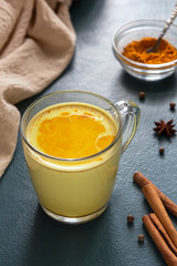 Indian turmeric latte on a blue background
