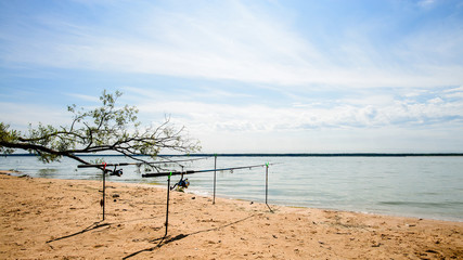 fishing rods for summer fishing on a lake or a large river