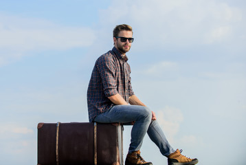 traveler wait for flight. Move. macho man unshaven face sit on tour bag. male fashion style....