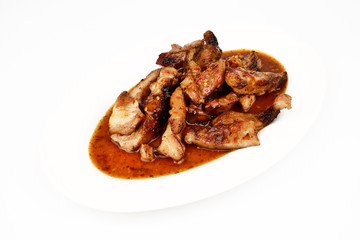 Assorted delicious Grilled pork and spicy sauce on a white plate isolated on white background