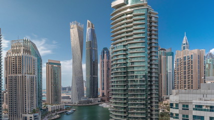 Obraz na płótnie Canvas Aerial view of Dubai Marina residential and office skyscrapers with waterfront timelapse