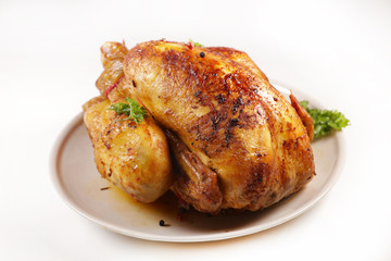 roasted chicken in plate, top view