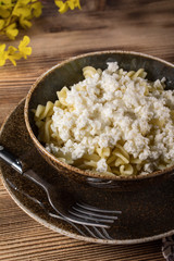 Fusilli pasta with cottage cheese, sugar and cinnamon.