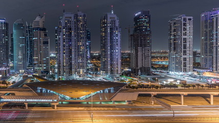 Fototapeta premium Aerial top view to Sheikh Zayed road near Dubai Marina and JLT timelapse, Dubai.