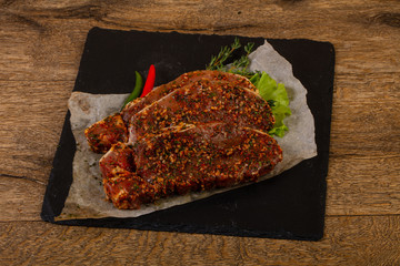 Raw marinated pork steak