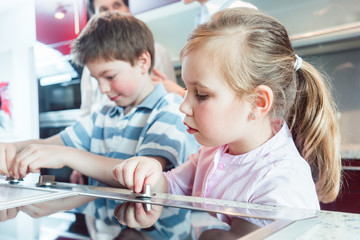 Family in the kitchen showroom