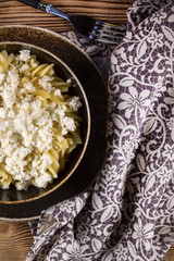 Fusilli pasta with cottage cheese, sugar and cinnamon.