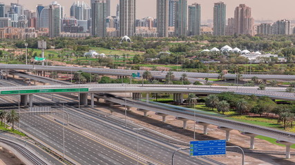 Fototapeta na wymiar Dubai Golf Course with a cityscape of Gereens and tecom districts at the background aerial timelapse