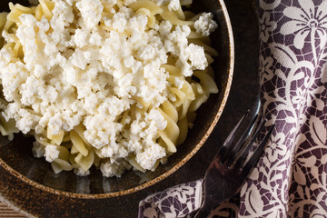 Fusilli pasta with cottage cheese, sugar and cinnamon.
