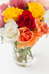 Bouquet of multicolored roses in vase