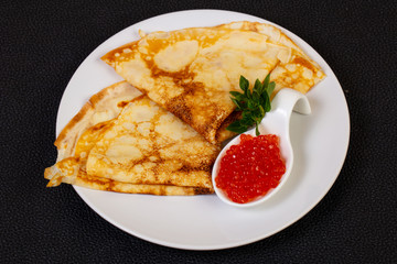 Pancake with red caviar