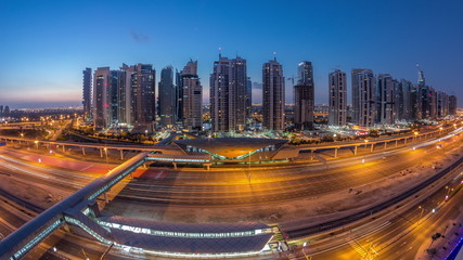 Fototapeta na wymiar Aerial top view to Sheikh Zayed road near Dubai Marina and JLT night to day timelapse, Dubai.