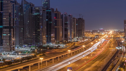 Aerial top view to Sheikh Zayed road near Dubai Marina and JLT night to day timelapse, Dubai.