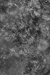 black and white decorative plaster background, dark gray stucco wall with copyspace , abstract wallpaper close up ,  ice macro, frozen winter texture