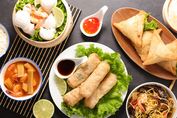 assorted of asian food with spring roll, soup, shrimp, rice