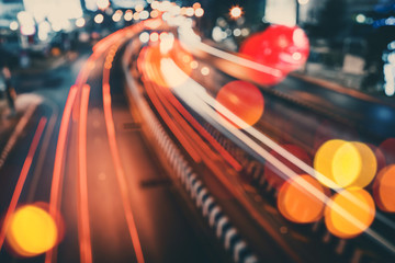 Blur traffic road with colorful bokeh light abstract background.
