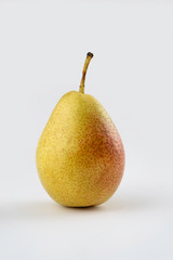ripe pear, with red and green colors, on white background