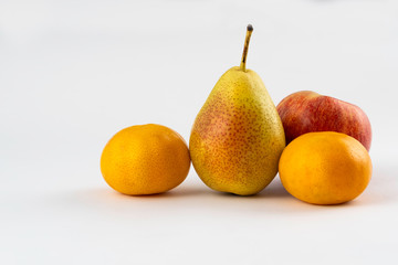 tangerines, pear and apple on white background