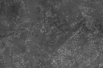 black and white decorative plaster background, dark gray stucco wall with copyspace , abstract wallpaper close up ,  ice macro, frozen winter texture