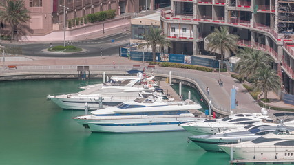 Fototapeta na wymiar Waterfront promenade in Dubai Marina aerial timelapse. Dubai, United Arab Emirates