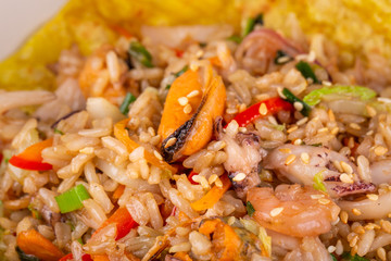 Rice with shrimp, mussels and octopuses with vegetables and greens