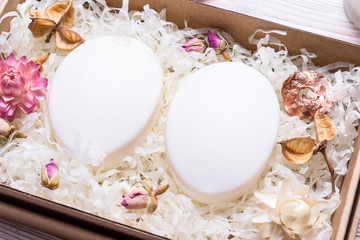 Natural homemade soap in cardboard box on wooden table