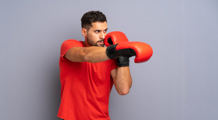 Young sport man with boxing gloves