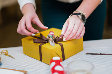 Female hands unpacking a gift