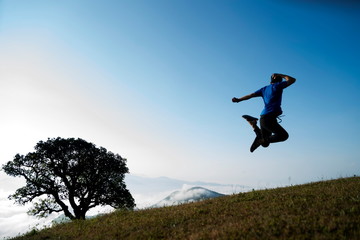 man jumps high in the mountain