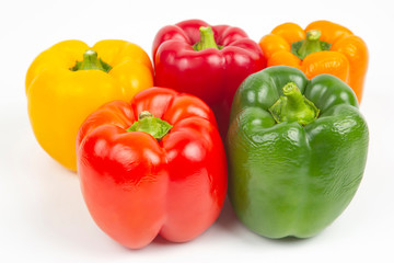 colored bell peppers on a white background. vitamin food