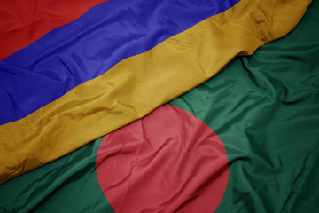 waving colorful flag of bangladesh and national flag of armenia.