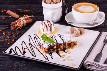 Apple strudel with nuts, served with vanilla ice cream ball