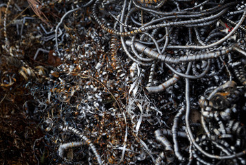 Pile of scrap metal. Rusty metal pipes and fillings. Materials for recycling from manufacturing process.