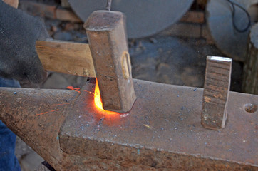 The work of a blacksmith. Creating a horseshoe in the old tradition