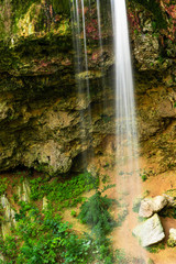 Smooth waterfall in the forest on mountain