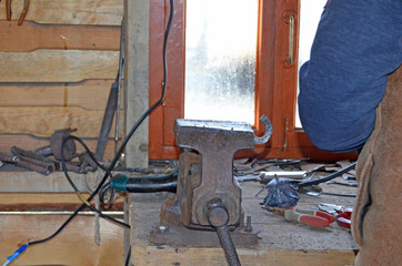 The work of a blacksmith. Creating a horseshoe in the old tradition