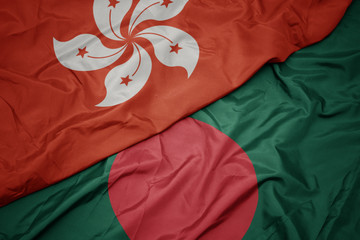 waving colorful flag of bangladesh and national flag of hong kong.