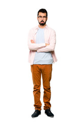 Full-length shot of Handsome man with beard with sad and depressed expression over isolated white background