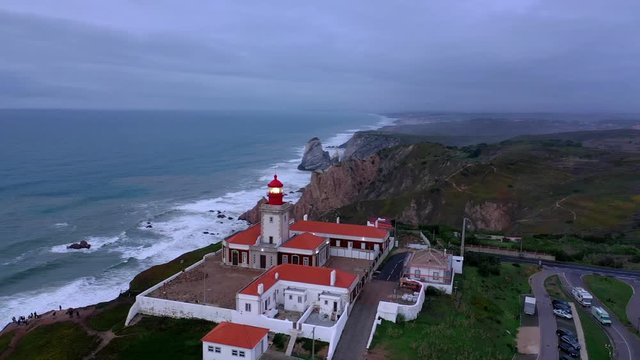 Evening view over the lighthouse of Cabo da Roca in Portugal - aerial drone footage