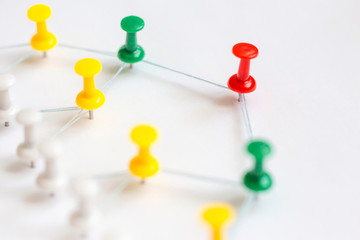 Group colorful pins on white. Structure, network marketing, social media concept.
