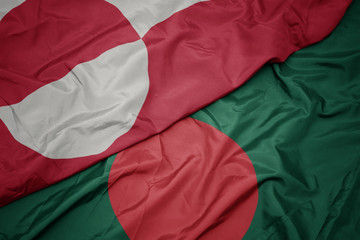 Fototapeta premium waving colorful flag of bangladesh and national flag of greenland.