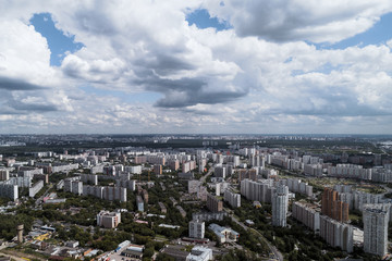 Obraz premium Big city, aerial view. The microdistrict of a big city, residential buildings with many high-rise buildings.