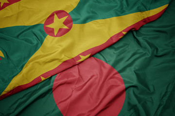 waving colorful flag of bangladesh and national flag of grenada.