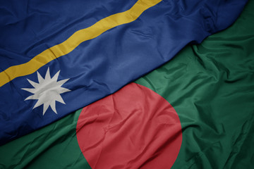 waving colorful flag of bangladesh and national flag of Nauru .