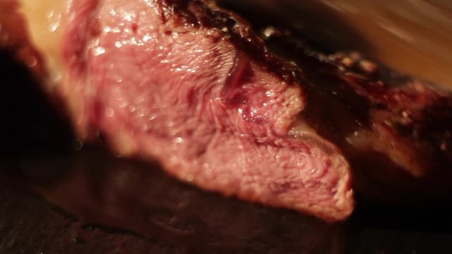 A piece of meat being cut